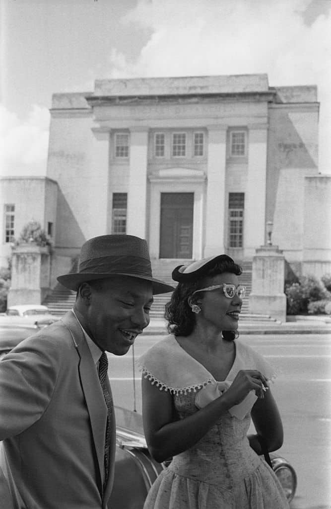 MONTGOMERY, AL - MAY 1956: Civil rights leader Reverend Dr. Martin Luther King, Jr.and his wife Coretta Scott King pose for a photo across the street from the Alabama Judicial Building in May 1956 in Montgomery, Alabama.