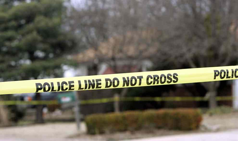 PARK CITY, KS - FEBRUARY 26: Police tape hangs across the street in front of the house that Dennis Rader lives in February 26, 2005 in Park City, Kansas. Rader is the suspect whom police have arrested on suspicion of first-degree murder in connection with the 10 deaths now tied to the serial killer known as BTK.