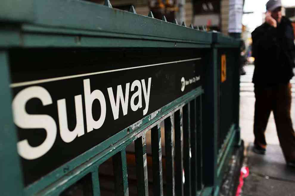 NEW YORK, NY - DECEMBER 05: A man walks past a subway stop in Manhattan two days after a man was pushed to his death in front of a train on December 5, 2012 in New York City. The incident was caught by a photographer and has since raised questions as to why someone didn't help the man before the train struck him. The New York City subway system, with 468 stations in operation, is the most extensive public transportation system in the world. It is also one of the world's oldest public transit systems, with the first underground line of the subway opening on October 27, 1904.