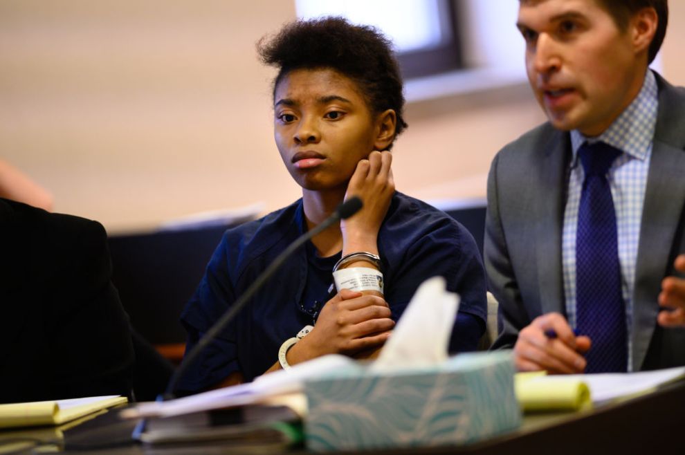 KENOSHA, WISCONSIN - NOVEMBER 13: Chrystul Kizer is pictured during a hearing in the Kenosha County Courthouse on November 15, 2019. On the right is her lawyer, public defender Carl Johnson. She was 16 years old when she met Randal P. Volar III, 33, at a bus stop. He offered to give her a ride home, then got her number. The next time they met, according to Chrystul, he took her to dinner and shopping then made clear what he expected in return. For two years, Volar regularly engaged in sexual abuse of Chrystul, and without her knowing it, filmed their interactions. Little did she know, Volar was under investigation by local police for abusing and filming many more girls but they had not yet arrested him. One night, after resisting his advances, Chrystul shot Volar in the head. She lit his house on fire and fled in his car. After posting about the crime on Facebook Live, she was arrested and charged with his murder. Now, her case is at the center of a nationwide debate, taking place in the post Me Too era, about what it means to be a victim, which women are believed, and who should be held accountable.