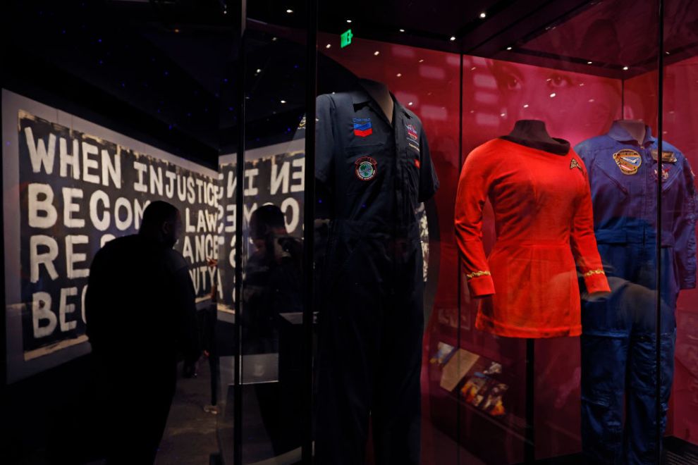 WASHINGTON, DC - MARCH 24: (L-R) A flight suit Trayvon Martin wore when he attended Experience Aviation in his early teens, the costume worn by actor Nichelle Nichols in her groundbreaking role as Lt. Nyota Uhura in the science fiction television series Star Trek, and former NASA Administrator Charles Bolden's suit from his first space flight are all on display at the temporary exhibit Afrofuturism: A History of Black Futures at the Smithsonian National Museum of African American History and Culture on March 24, 2023 in Washington, DC. The exhibit assembles more than 100 objects from music, film, television, comic books, fashion, theater, literature and more that covers more than a century of Afrofuturism.