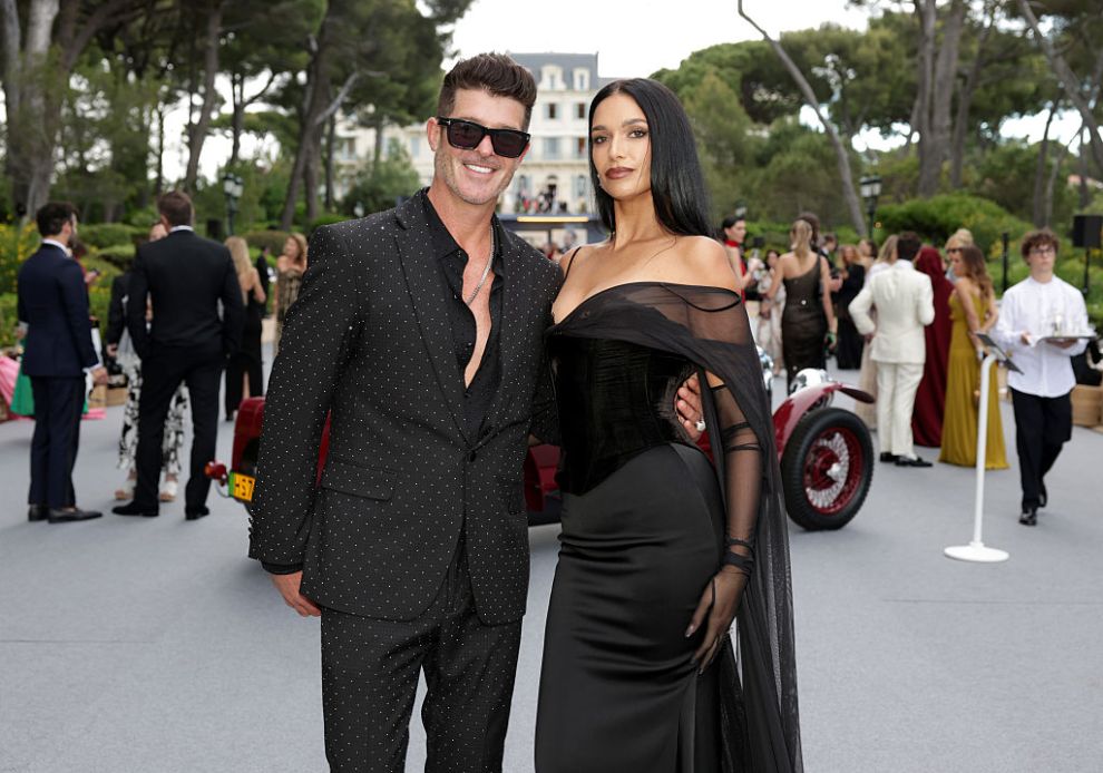CAP D'ANTIBES, FRANCE - MAY 22: (L-R) Robin Thicke and April Love Geary attend the amfAR Gala Cannes 2025 presented by Chopard at Hotel du Cap-Eden-Roc on May 22, 2025 in Cap d'Antibes, France.