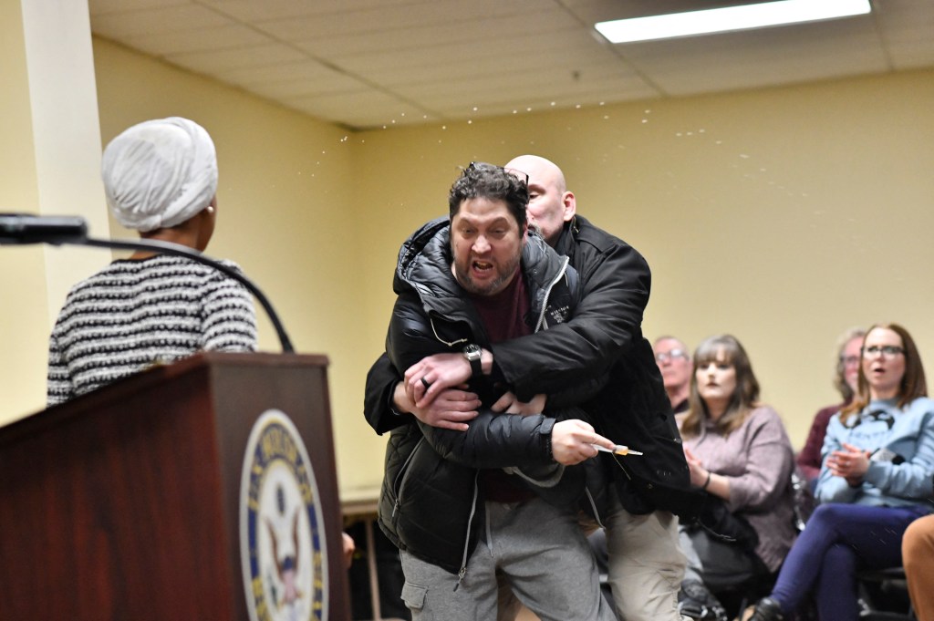 Man Sprays Substance On Rep. Ilhan Omar During Town Hall